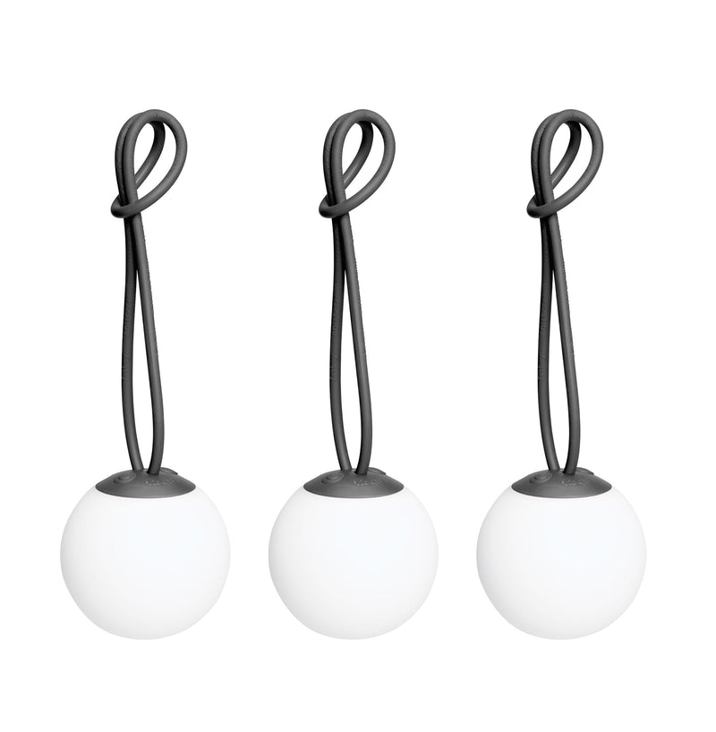 Bolleke Mini set of 3, with anthracite loop, brings warm, portable light to indoor and outdoor spaces.
