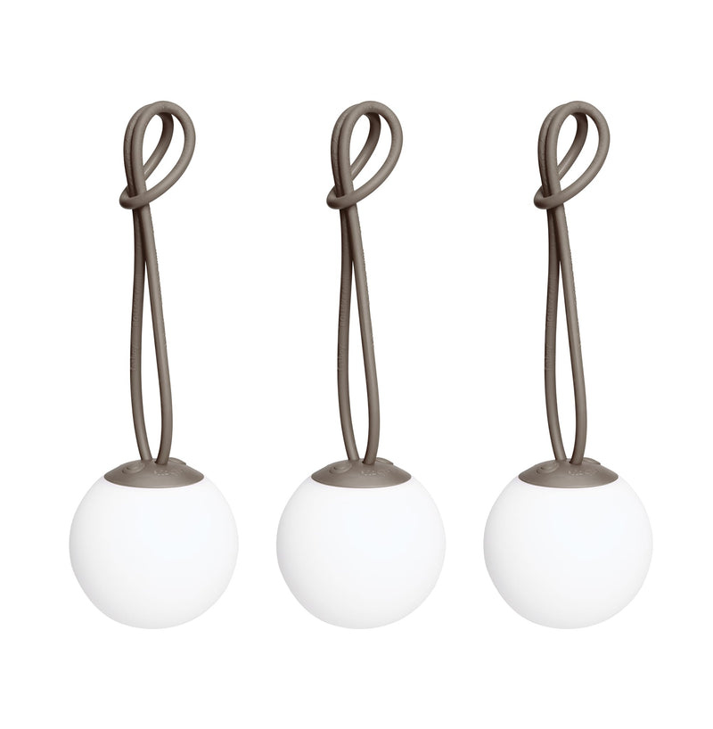 Bolleke Mini set of 3, with taupe loop, brings warm, portable light to indoor and outdoor spaces.